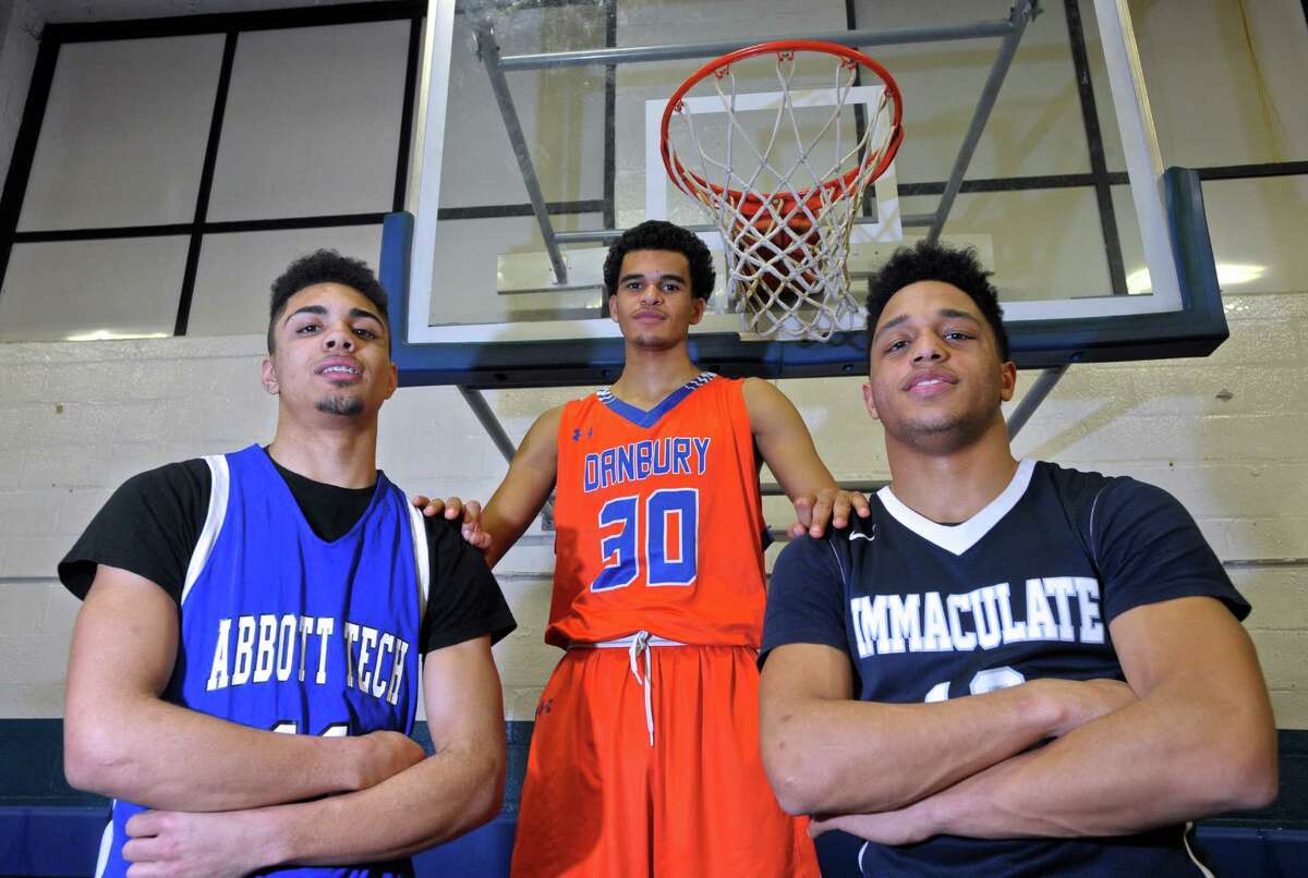Three Danbury high schools, Abbott Tech, Danbury and Immaculate, are playing for their league’s boys basketball championship on Thursday. Representing their schools are, from left, Nick Placella from Abbott Tech, Scott Nesbitt from Danbury High School and Darius Smith from Immaculate High School.