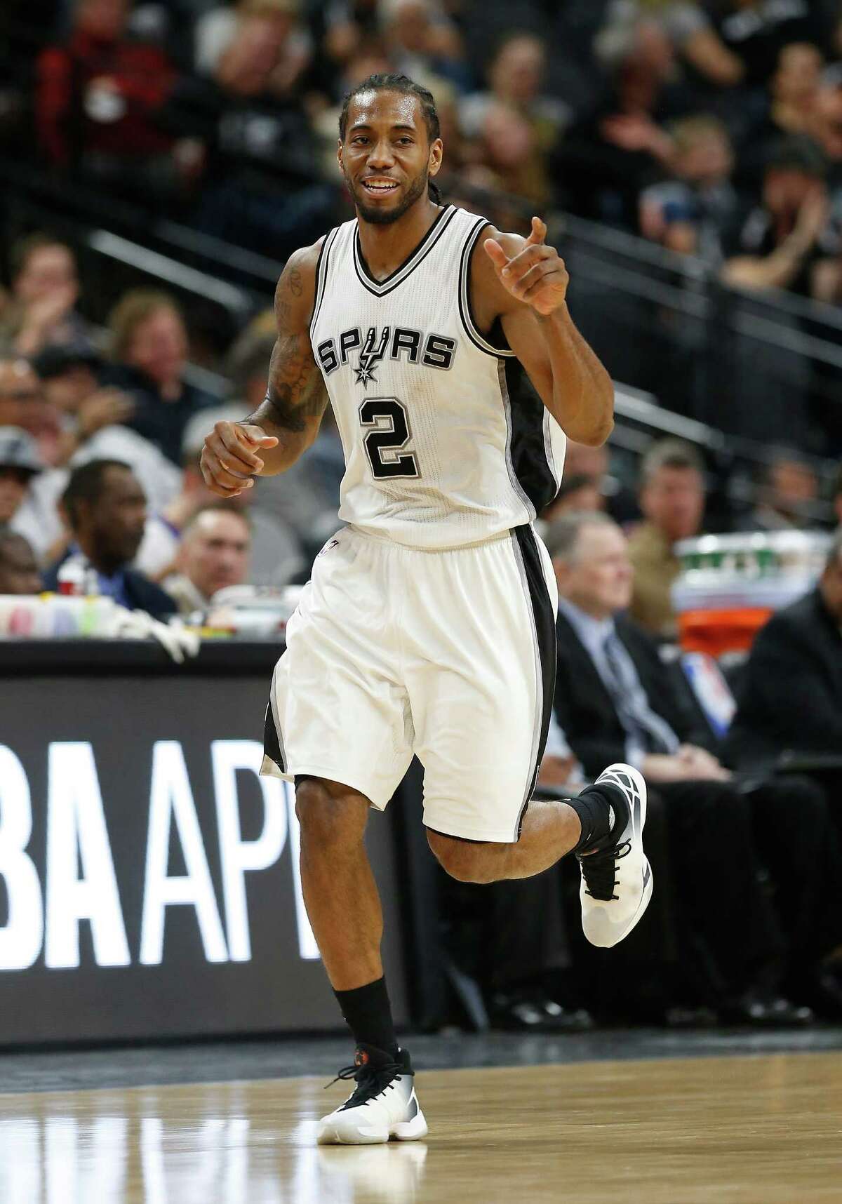 Spurs' Kawhi Leonard (02) smiles after a score against the Detroit Pistons at the AT&T Center on Wednesday, Mar. 2, 2016. Spurs defeated the Pistons, 97-81. (Kin Man Hui/San Antonio Express-News)