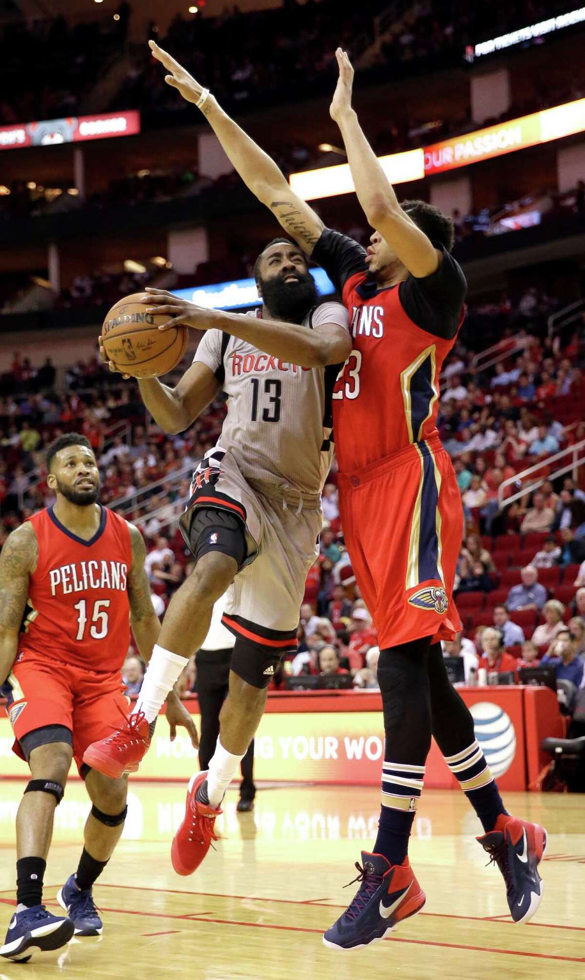 The Rockets' James Harden goes up for a shot as the Pelicans' Anthony Davis (23) defends. Harden had a game-high 39 points.