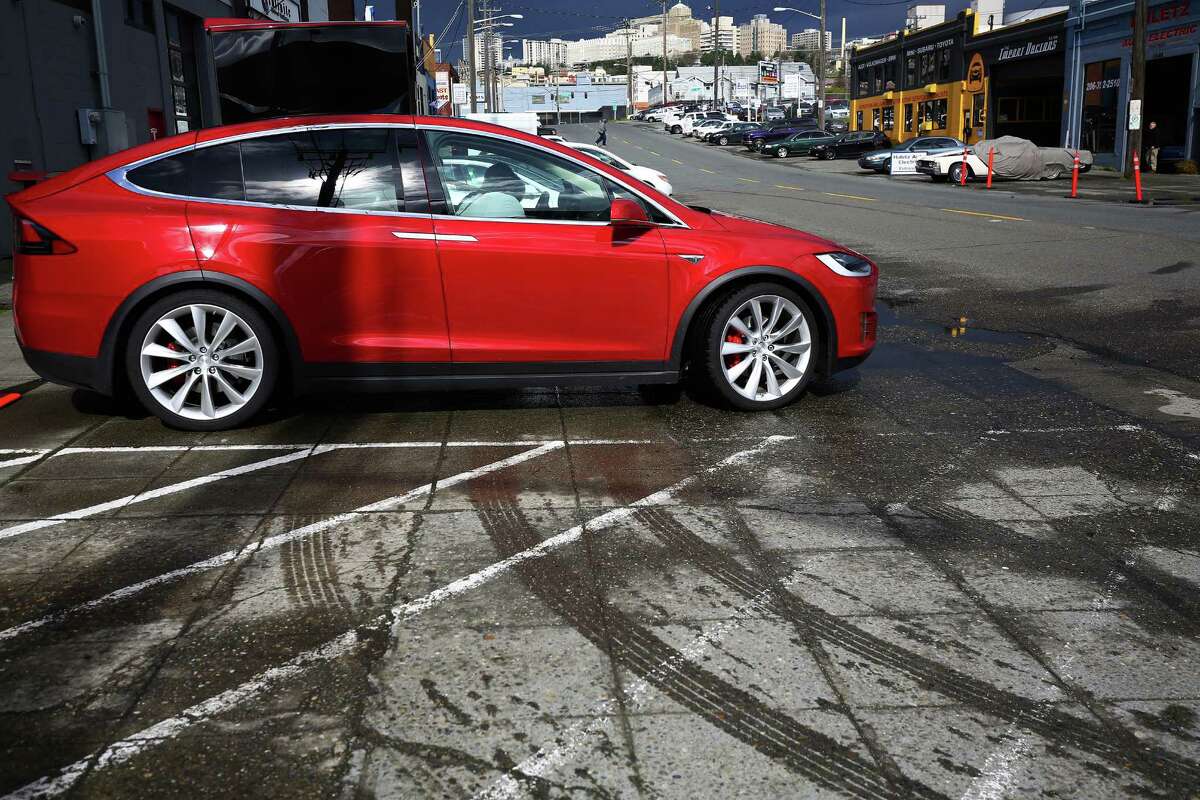 Tesla showed off its new Model X to customers at a private event at its Sodo service center, giving them the chance to get up close and personal with the car, Thursday, March 3, 2016.