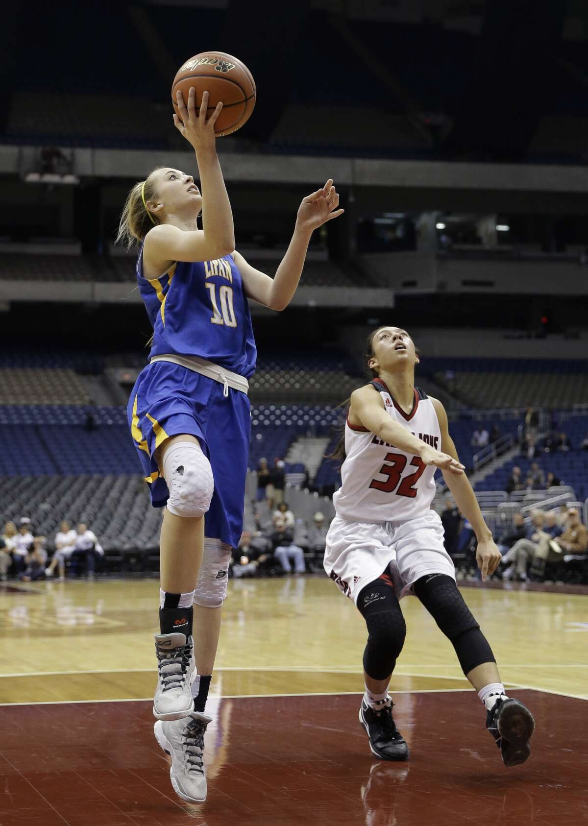 Lipan High School's Lanie Roberts (10) drives to the basket past Roby High School's Isabel Carrion (32) during a UIL Class 1A girls high school state semifinal basketball game, Thursday, March 3, 2016, in San Antonio.Lipan won 74-46; Roberts scored 49 points. (AP Photo/Eric Gay)