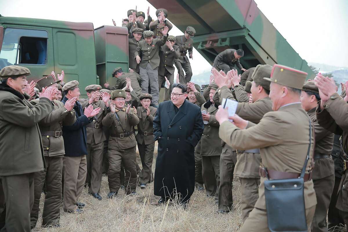 This undated picture released from North Korea's official Korean Central News Agency (KCNA) on March 4, 2016 shows North Korean leader Kim Jong-Un (C) inspecting a test-fire of the new-type large-caliber multiple launch rocket system at an undisclosed location. REPUBLIC OF KOREA OUT AFP PHOTO / KCNA via KNS THIS PICTURE WAS MADE AVAILABLE BY A THIRD PARTY. AFP CAN NOT INDEPENDENTLY VERIFY THE AUTHENTICITY, LOCATION, DATE AND CONTENT OF THIS IMAGE. THIS PHOTO IS DISTRIBUTED EXACTLY AS RECEIVED BY AFP. ---EDITORS NOTE--- RESTRICTED TO EDITORIAL USE - MANDATORY CREDIT "AFP PHOTO/KCNA VIA KNS" - NO MARKETING NO ADVERTISING CAMPAIGNS - DISTRIBUTED AS A SERVICE TO CLIENTSKCNA/AFP/Getty Images