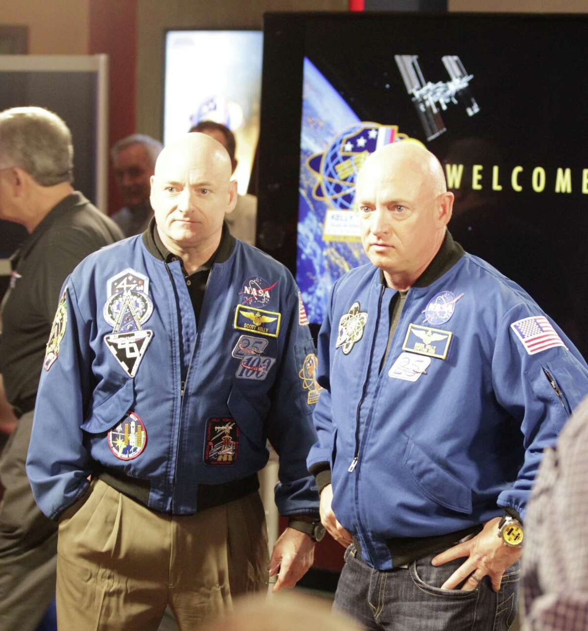 Scott Kelly left, and his twin brother Mark Kelly right, are pictured during a photo-op before a press conference at Johnson Space Center, Friday, March 4, 2016. Scott Kelly just completed nearly a year long stay aboard the International Space Station.