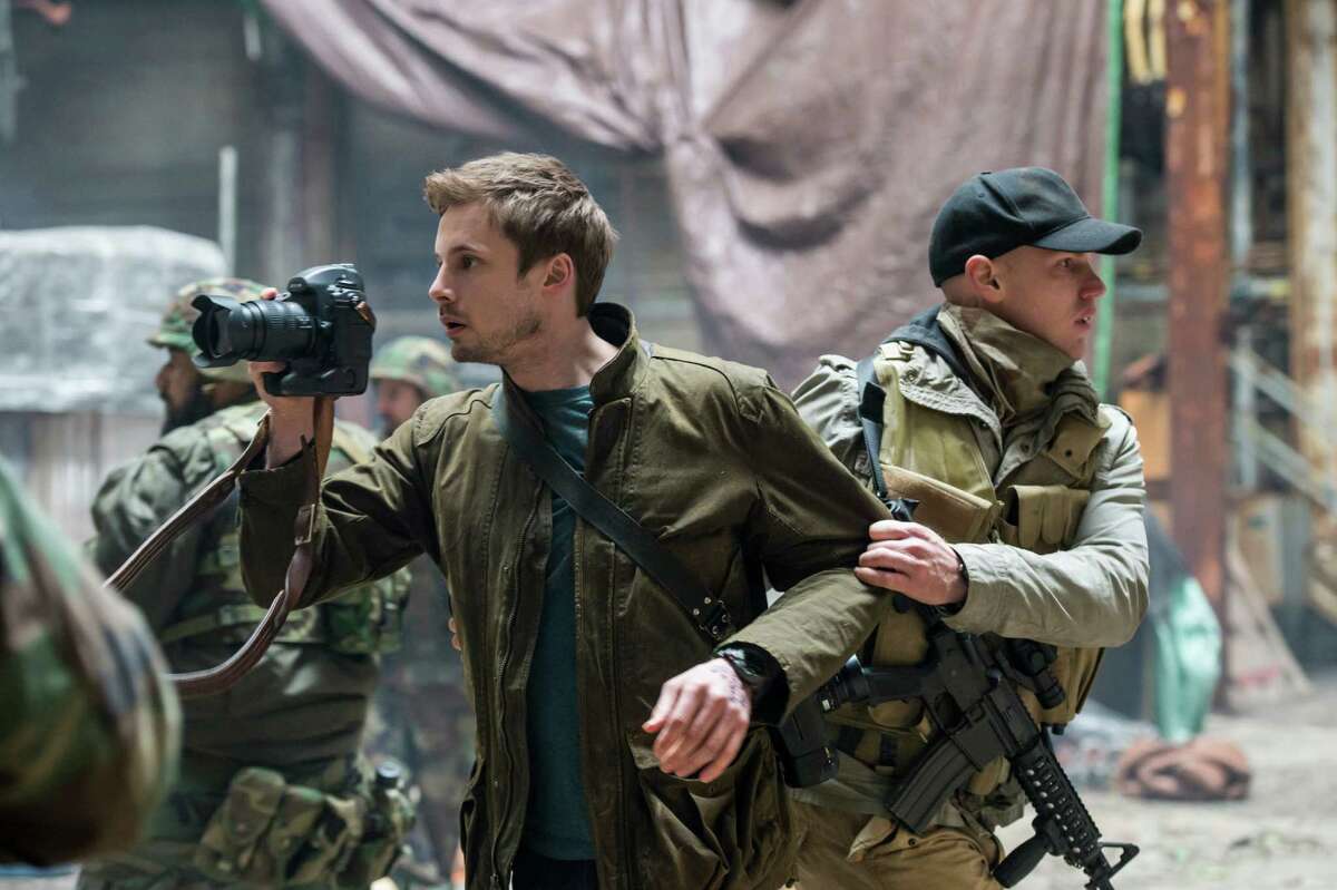 Damien Thorne (Bradley James) is a war photographer with washboard abs in A&E’s “Damien: The Beast Rises.”