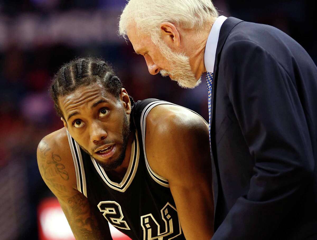 San Antonio Spurs forward Kawhi Leonard talks to San Antonio Spurs head coach Gregg Popovich between plays in the second half in New Orleans, on March 3, 2016.