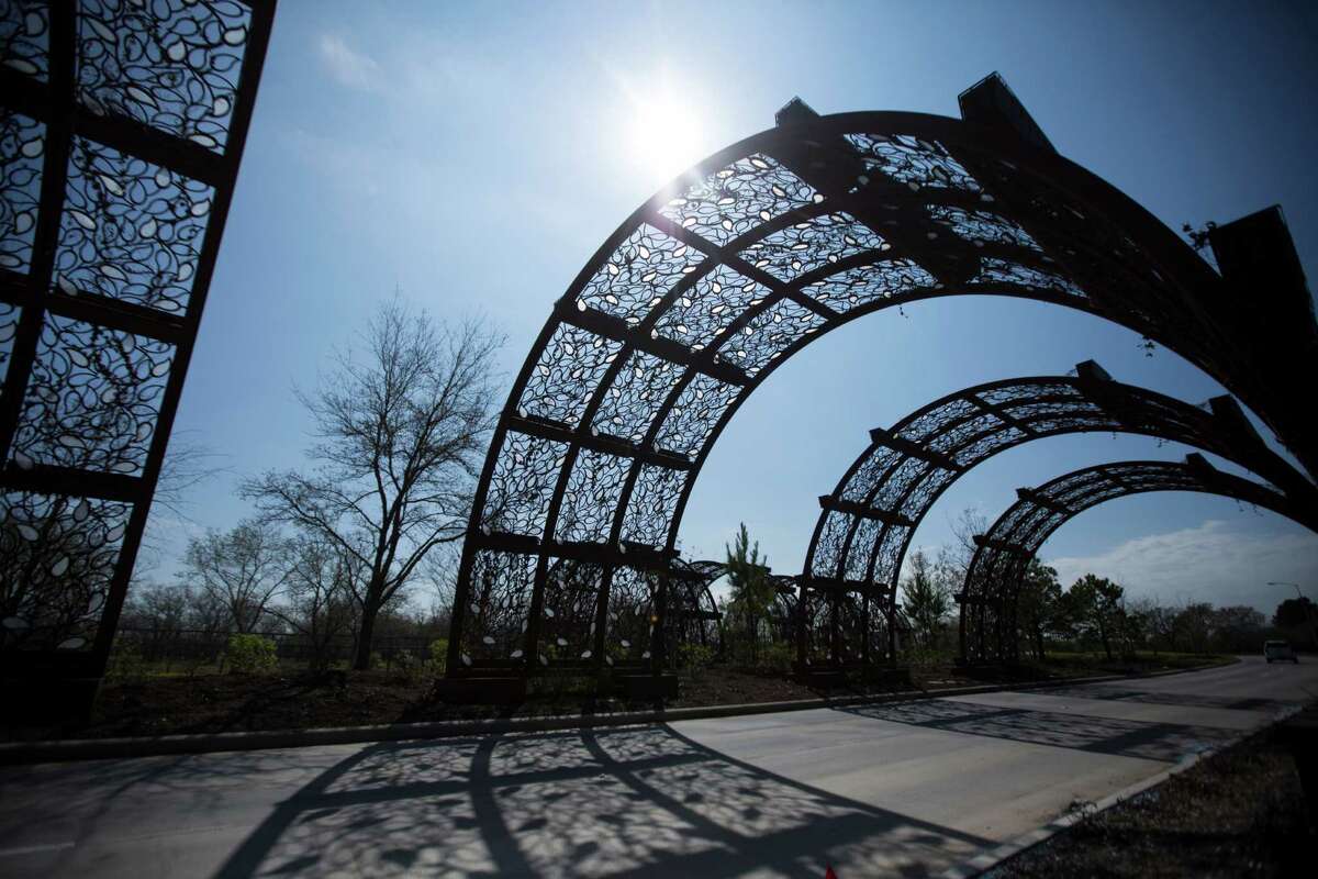 The entrance to Cane Island has several arches that light up at night. The master-planned community, expected to eventually have more than 2,000 homes.