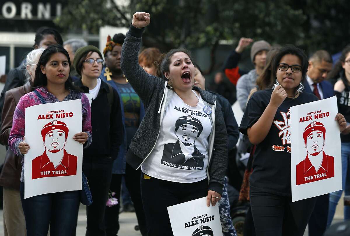 Violeta Vasquez (center) joins other supporters to demand justice for Alex Nieto during a rally at the Phillip Burton Federal Building in San Francisco, Calif. on Tuesday, March 1, 2016. Jury selection and opening arguments were scheduled to get underway Tuesday in a federal civil rights trial against four police officers who shot and killed Alex Nieto in Bernal Heights Park nearly two years ago.