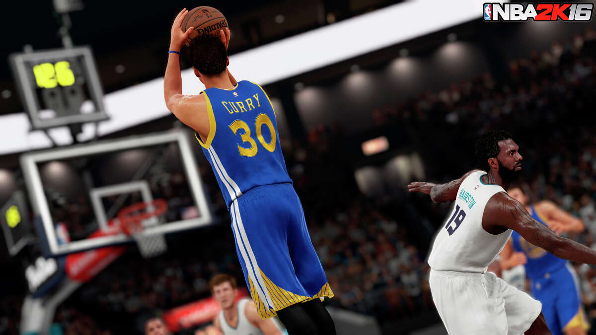 The video game version of Warriors star Stephen Curry goes up for a shot against the Charlotte Hornets in a screen shot from “NBA 2K16.”