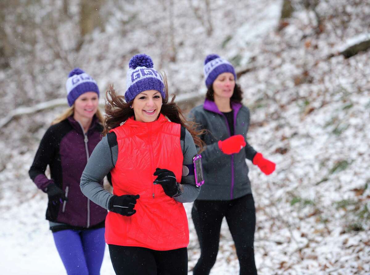 Gina Ancona, center, flanked by Kelly Buck, left, and Sharon Mullen trains with her running group, Girls Gone Miles, Friday, Mar. 4, 2016 along the Pequonnock River Trail off Taits Road in Trumbull, Connecticut. The all-women running group in Trumbull trains for the 200-mile RAGNAR at Cape Cod in May every year and is also involved in philanthropy. In March they will be holding a fundraiser in Westport to benefit the McGivney Community Center in Bridgeport. Last year they raised about $13,000 for the Lyme Research Alliance.