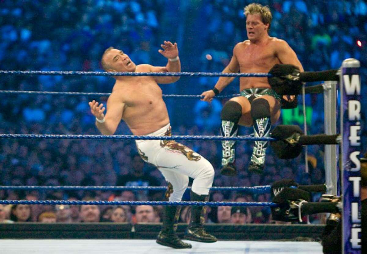 HOUSTON, TX - APRIL 5: (L-R) Former professional wrestler Ricky "The Dragon" Steamboat gets kicked by WWE Superstar Chris Jericho during WrestleMania 25 at Reliant Stadium on April 5, 2009 in Houston, Texas. (Photo by Bill Olive/Getty Images) *** Local Caption *** Chris Jericho;Ricky "The Dragon" Steamboat