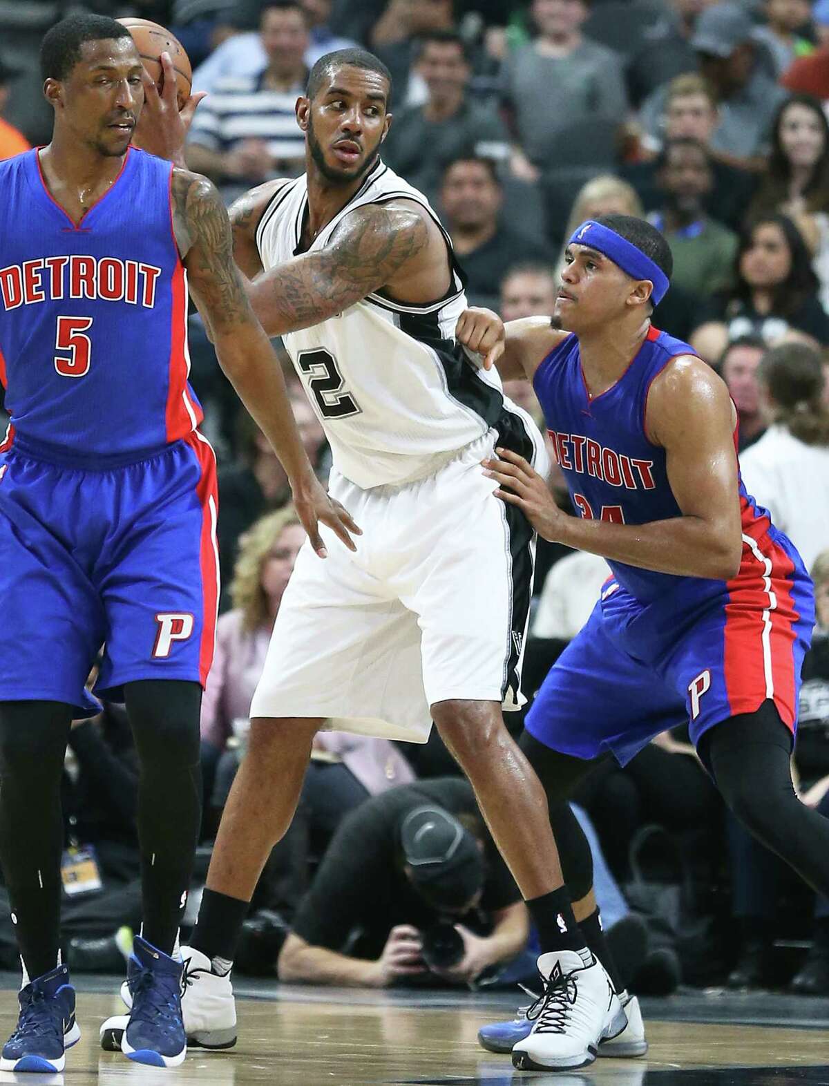 LaMarcus Aldridge posts on Tobias Harris as the Spurs host the Pistons at the AT&T Center on March 2, 2016.