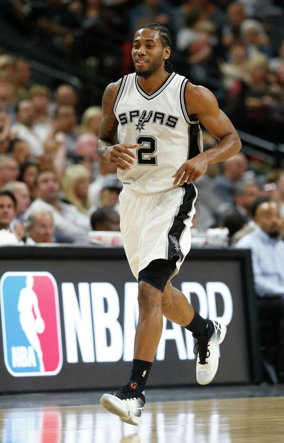 Spurs' Kawhi Leonard (02) smiles after scoring against the Detroit Pistons at the AT&T Center on Wednesday, Mar. 2, 2016. Spurs defeated the Pistons, 97-81. (Kin Man Hui/San Antonio Express-News)