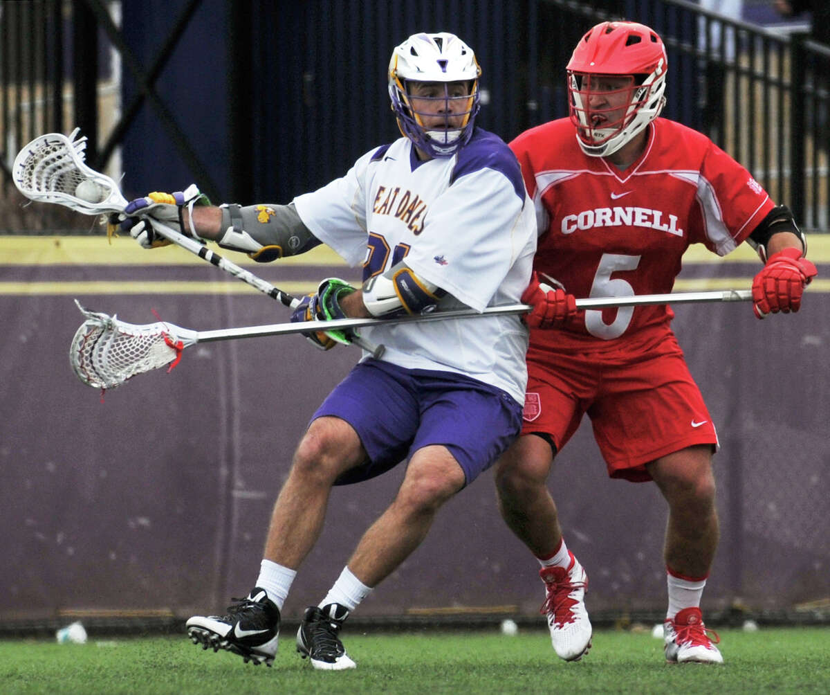 Seth Oaks pushes off Cornell University's defense for an attempt goal during their Saturday, March 5, 2016, game on John Fallon's Field in University at Albany, Albany, N.Y. (Brittany Gregory / Special to the Times Union)