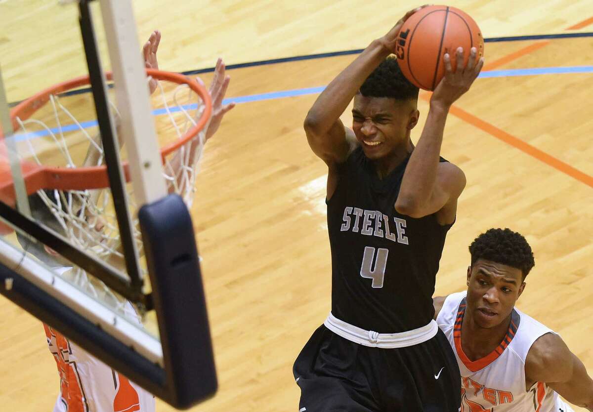 Kijana Love of Steele penetrates against Laredo United during Region IV-6A basketball championship action at the UTSA Convocation Center on March 5, 2016.