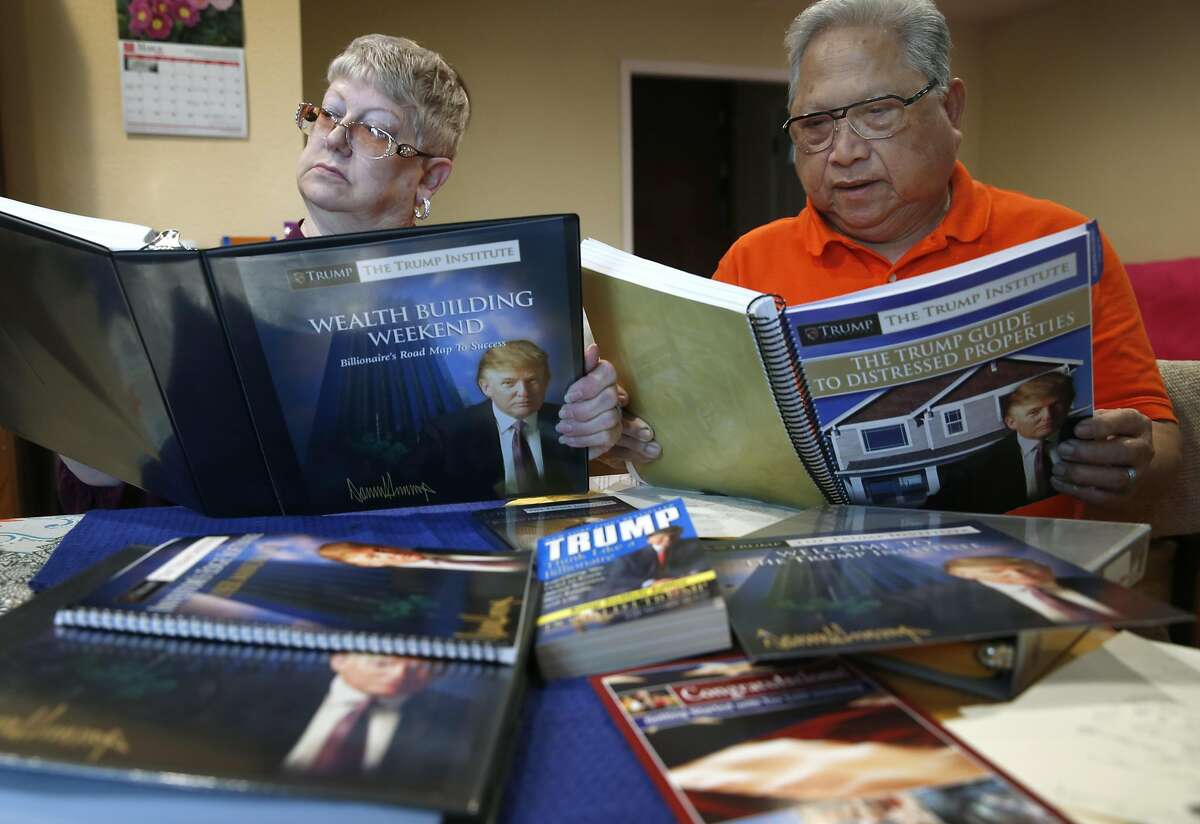 Felicisimo and Elaine Limon review material from Trump University at their home in El Sobrante, Calif. on Saturday, March 5, 2016. The Limons paid more than $35,000 to attend "Trump University" a number of years ago, believing that those who attended the seminars would get rich in real estate. Instead, they lost their money, went into debt, and nearly lost their house. Now they are part of a class-action lawsuit in California against the GOP presidential front runner.