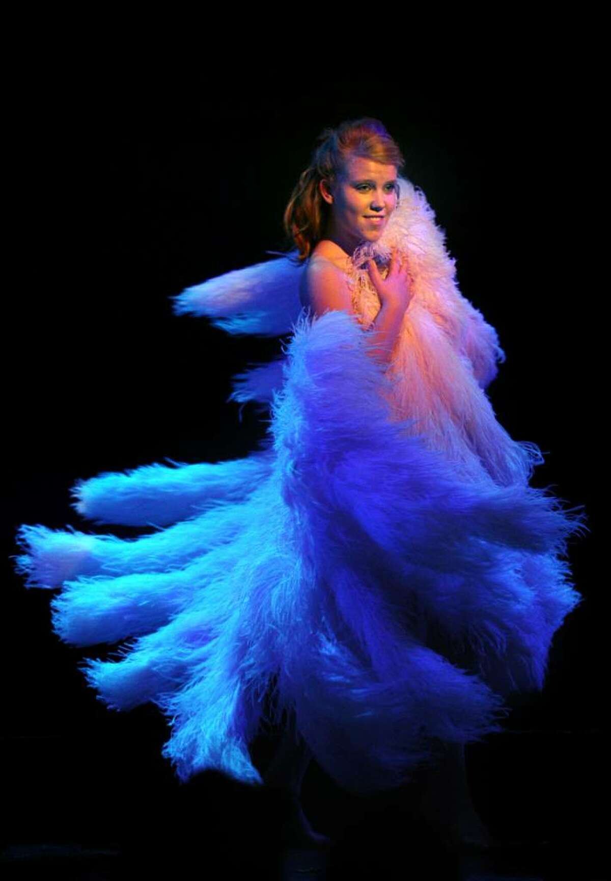 Seventeen-year-old, lead actress Amber Carpenter dances with giant fans made out of ostrich feathers and made to the same size and specification of the fans used by the burlesque dancer Sally Rand during the production "Fandance, The Life of Sally Rand" Friday Apr. 2, 2010 at the Downtown Cabaret Theatre in Bridgeport.