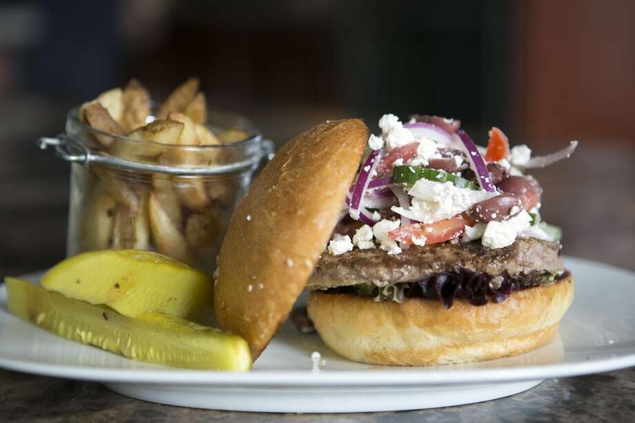 
&gt;&gt;&gt;Browse some of Houston's best African American-owned Houston bars &amp; restaurants.

Craft Burger Food Truck
Where: 712 Main Street 
Situated in downtown's Finn Hall, head here for inventive gourmet burgers, like the Greek-inspired on shown here. Photo: Courtesy / Craft Burgers