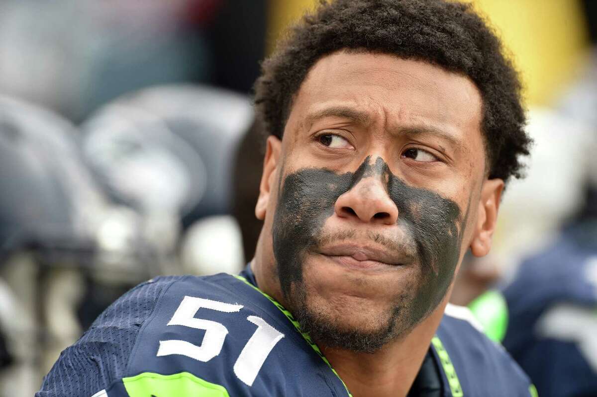 CHARLOTTE, NC - JANUARY 17: Bruce Irvin #51 of the Seattle Seahawks looks on during the NFC Divisional Playoff Game against the Carolina Panthers at Bank of America Stadium on January 17, 2016 in Charlotte, North Carolina.