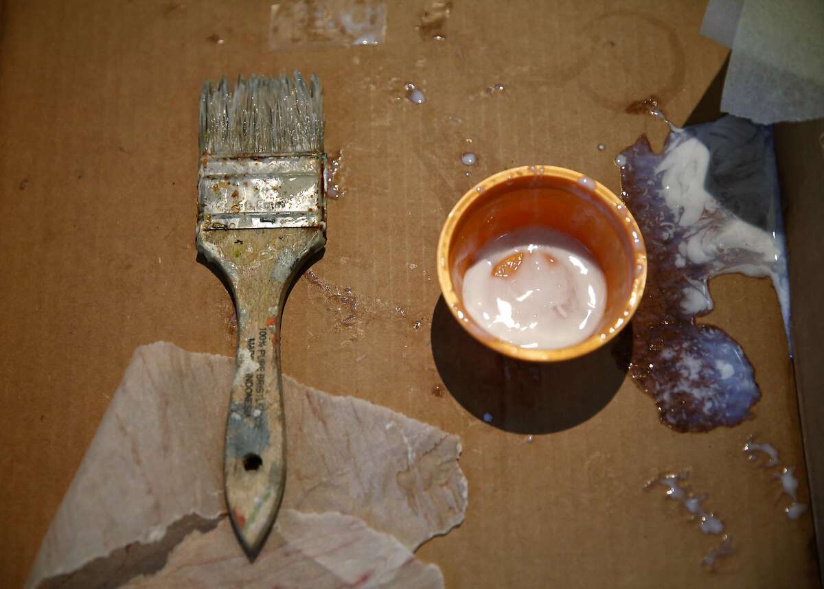 A paint brush and a container holding glue sit in a cardboard box at the Mission Neighborhood Center in San Francisco, California, on Sunday, March 6, 2016.