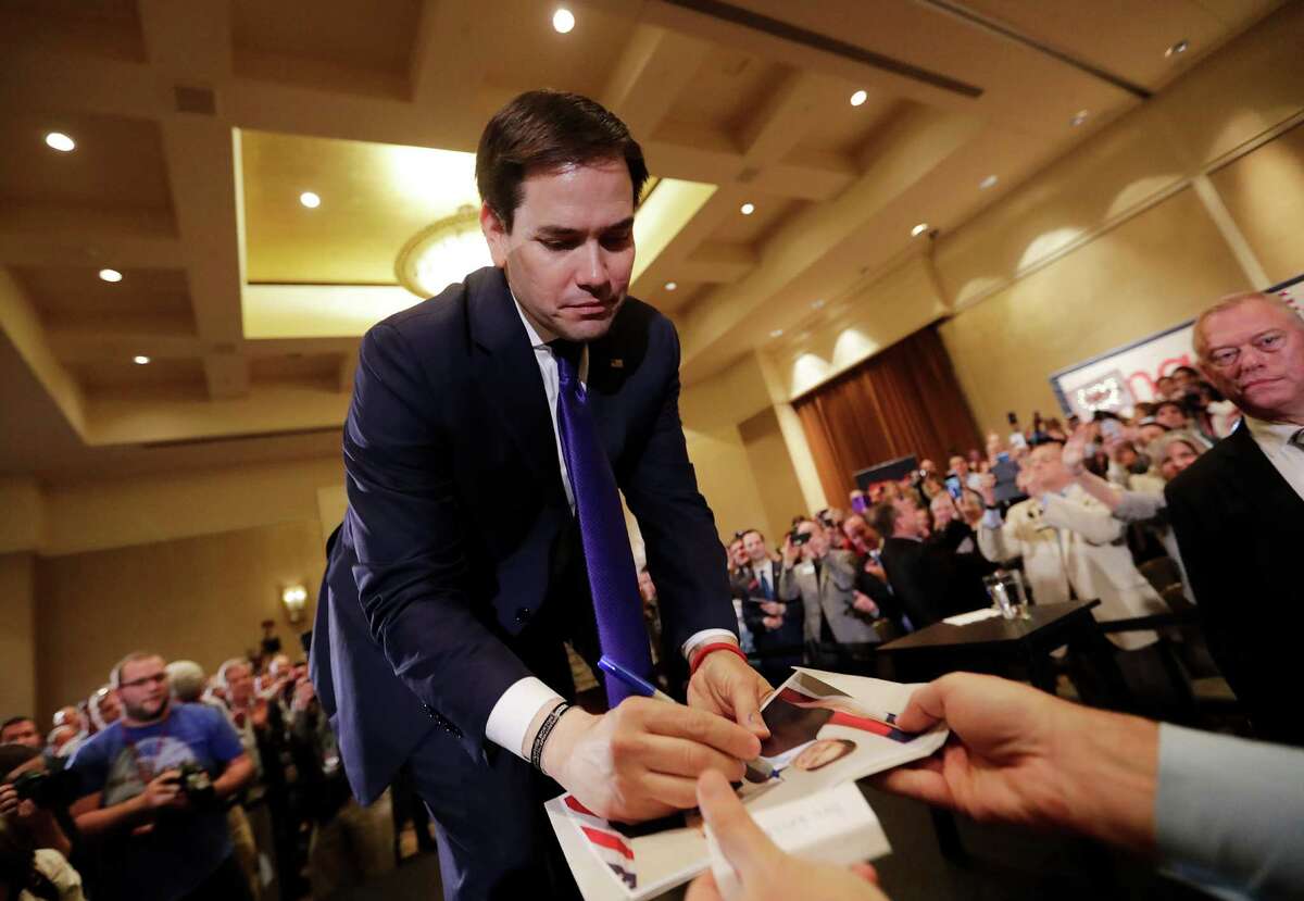 Republican presidential hopeful Sen. Marco Rubio signs autographs at a campaign event in Atlanta. A reader says supporting Rubio will damage Sen. Ted Cruz, which in turn will boost Donald Trump.