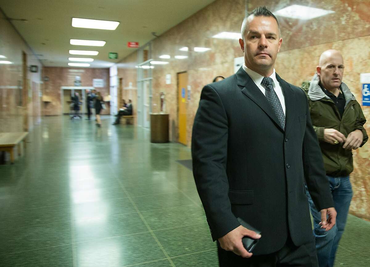 Former San Francisco Sheriff's Deputy Scott Neu makes his way his court appearance at the Hall of Justice, March 7, 2016, in San Francisco, Calif. Neu, 42, pleaded not guilty of allegedly staging gladiator-style fights between inmates.