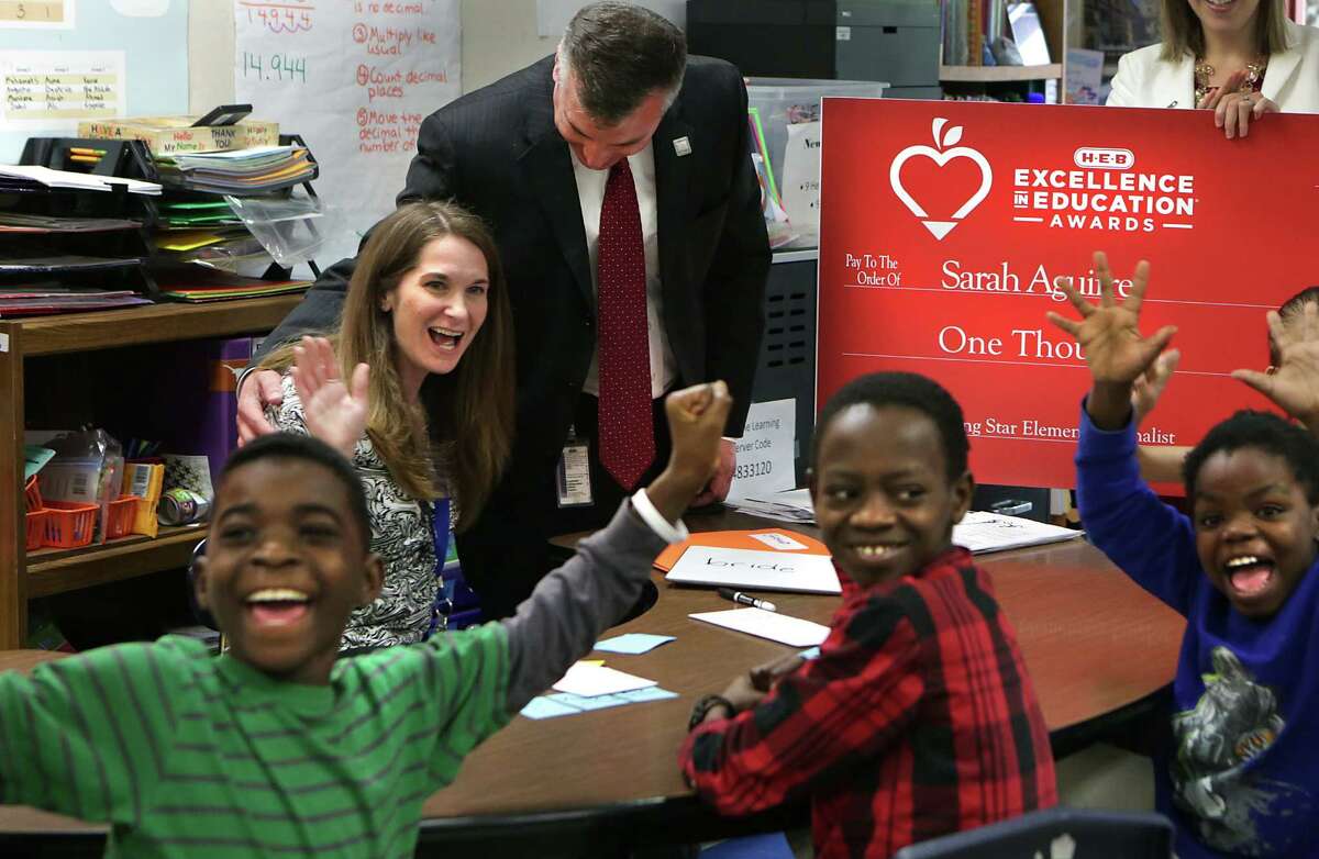 ISD Superintendent Brian Woods congratulates Sarah Aguirre of Colonies North Elementary School.