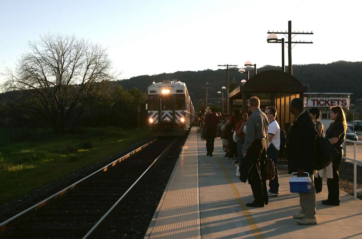 Passengers wait for an Altamont Commuter Express (ACE) train to arrive in Pleasanton for the commute home toward Stockton. 