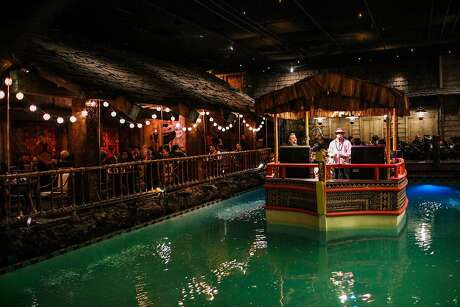 The Island Groove band plays on a boat in the middle of a pool, at the Tonga Room on Friday, March 4, 2016 in San Francisco, California.