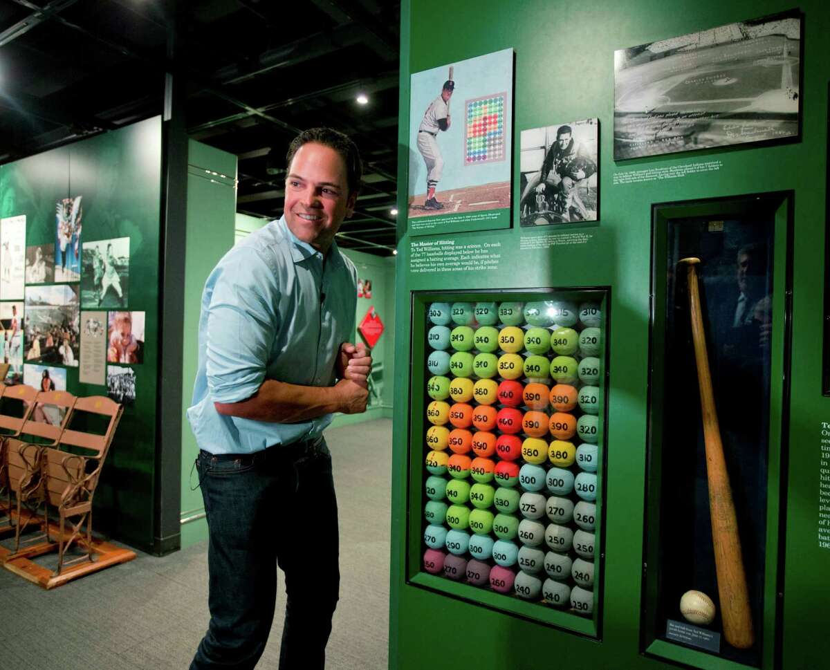 Baseball Hall of Fame electee Mike Piazza visits a Ted Williams exhibit during his orientation tour at the hall on Tuesday, March 8, 2016, in Cooperstown, N.Y. He will be inducted in July. (AP Photo/Mike Groll) ORG XMIT: NYMG101