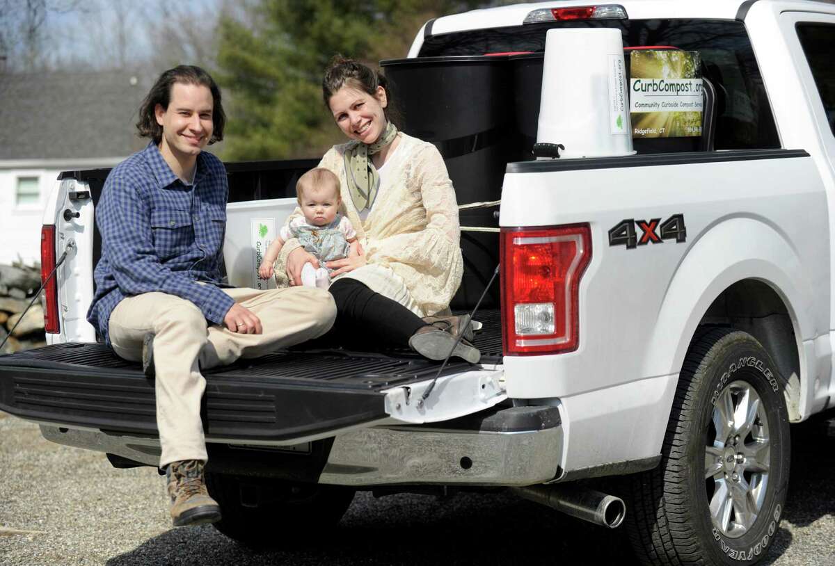 Nick and Erica Skeadas, 35, holding baby Genevieve, six-months-old, of Ridgefield, have started a new business, Curbside Compost. Photo Tuesday, March 8, 2016.
