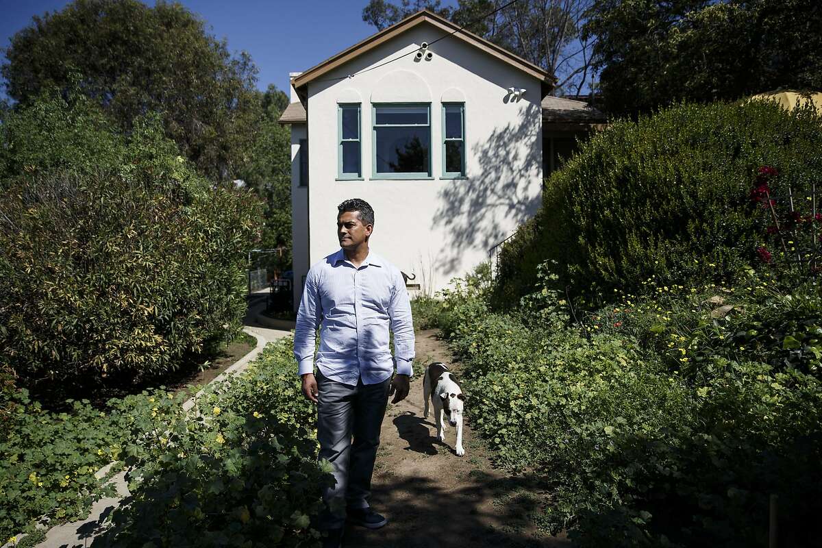 Franky Carrillo, arrested at age 16 and wrongly convicted in 1991 of murder before spending 20 years in prison, stands for a portrait outside his home on Tuesday, March 8, 2016 in the Echo Park neighborhood of Los Angeles, Calif. Carrillo said that while in prison the photographs he received in the mail from family and friends were very important to him. "These pictures (were) moments in people's lives that people would send me... I would sort of grow with them and feel that I was there," said Carrillo. "They reminded me that I was aging along with the people that were on the outside." Photo by Patrick T. Fallon/Special to The Chronicle