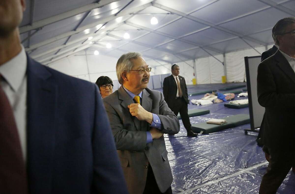 Mayor Ed Lee looks around the inside of a large tent as he tours the shelter at Pier 80 on Tuesday, February 23, 2016 in San Francisco, California.