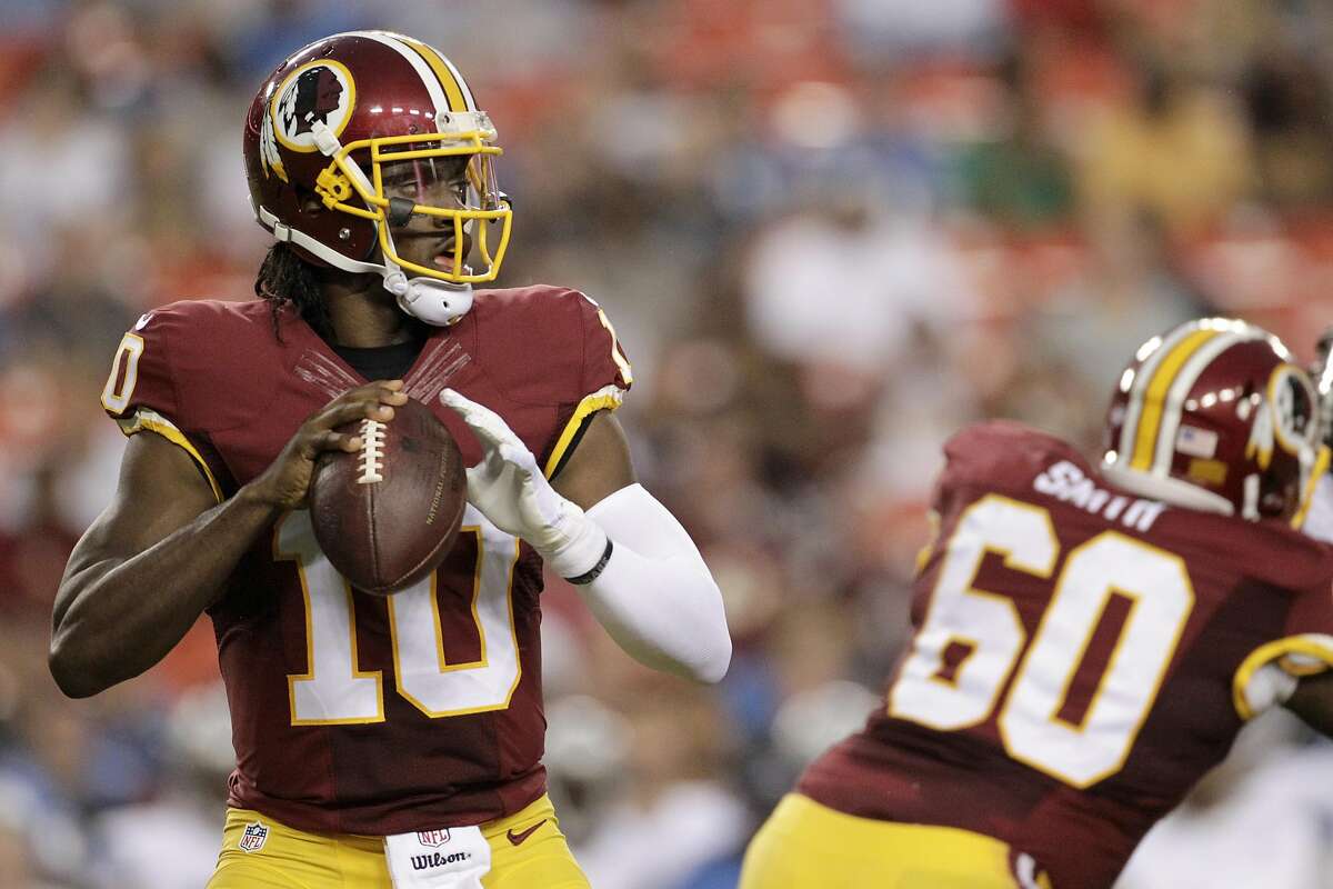 In this photo taken Aug. 20, 2015, Washington Redskins quarterback Robert Griffin III (10) passes the ball during the first half of an NFL preseason football game against the Detroit Lions in Landover, Md.