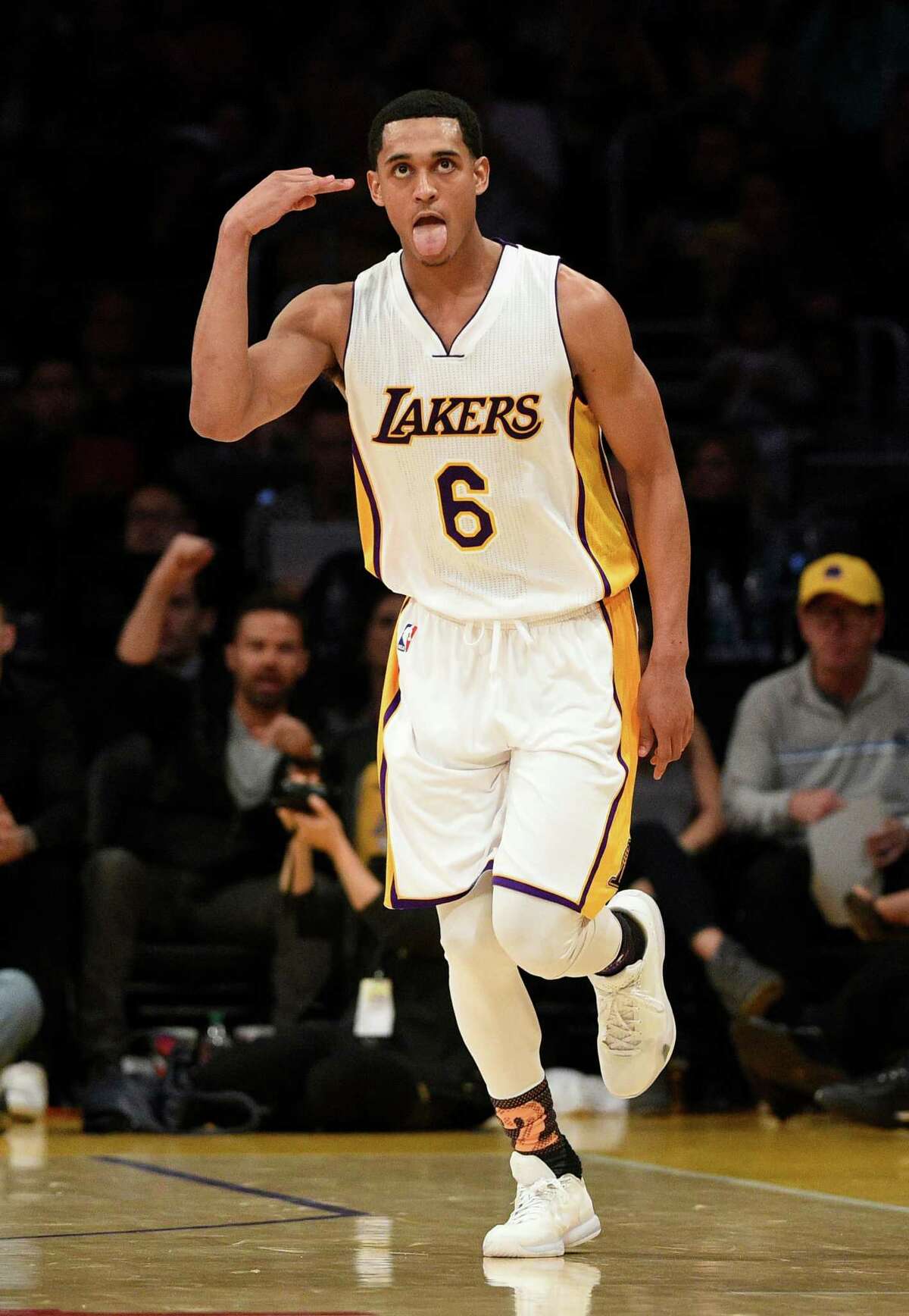 Los Angeles Lakers guard Jordan Clarkson reacts after he makes a three-point shot during the second half of an NBA basketball game against the Golden State Warriors in Los Angeles, Sunday, March 6, 2016. The Los Angeles Lakers won 112-95.