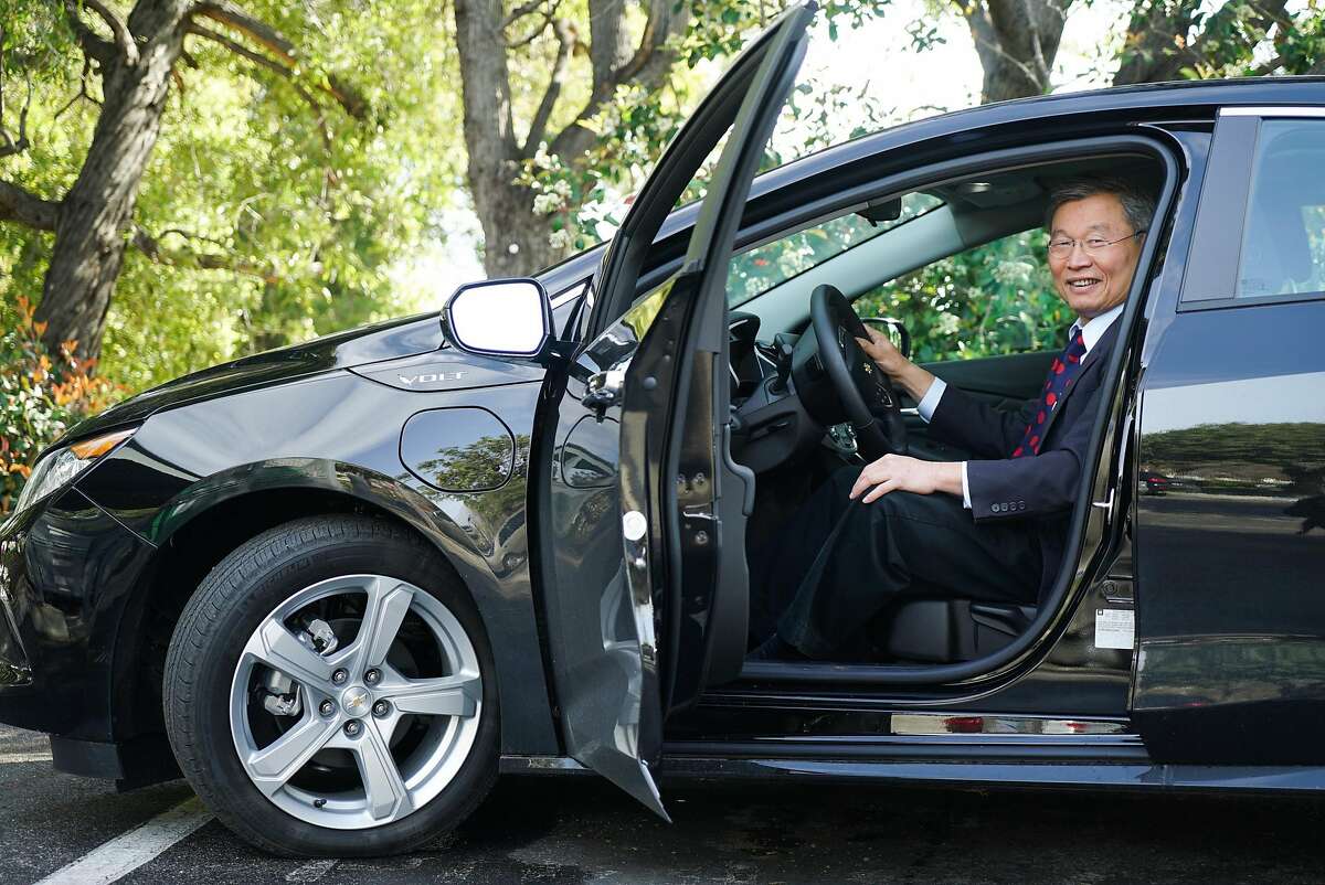 Mayor Barry Chang poses for a photograph in his electric Chevy Volt at Cupertino City Hall in Cupertino, Calif. on Wednesday, March 9, 2016. The mayor would like companies such as Apple to pay more in taxes in order to fund shuttles that would bus people to and from Caltrain.