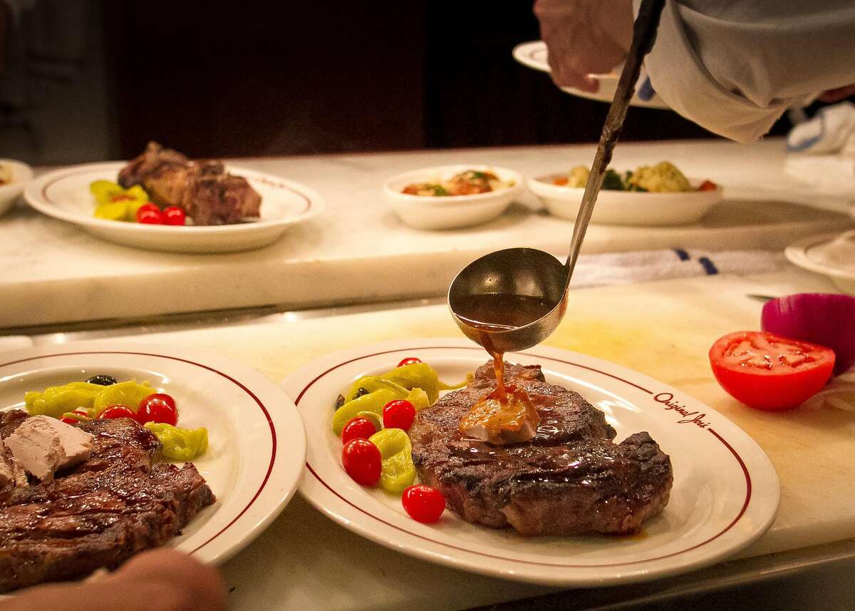 A steak being sauced at Original Joe's Restaurant in San Francisco, Calif., on Tuesday, March 20th, 2012.