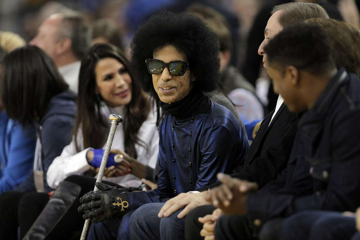 Prince sits courtside in the first half as the Golden State Warriors played the Oklahoma City Thunder at Oracle Arena in Oakland, Calif., on Thursday, March 3, 2016.