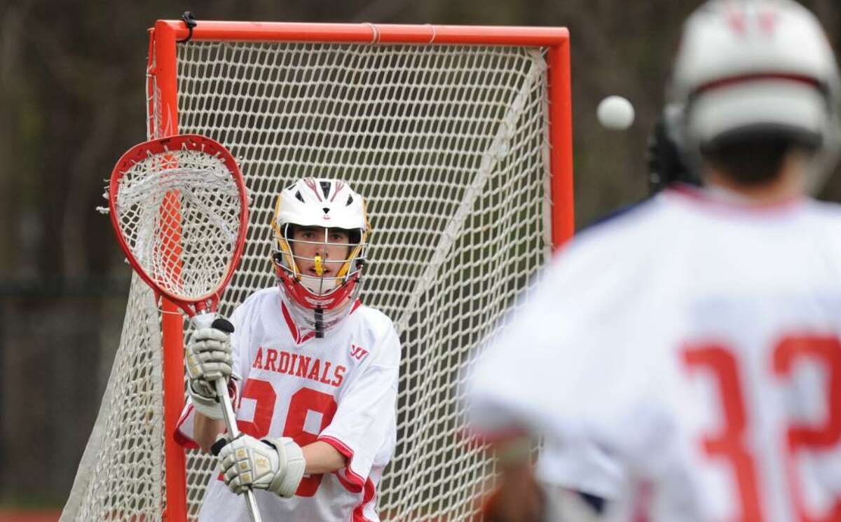 Greenwich High School goalie, Daniel Feeney, prepares to stop a shot during a 9-8 overtime loss to New Fairfiled High School at GHS, April, 9, 2010.