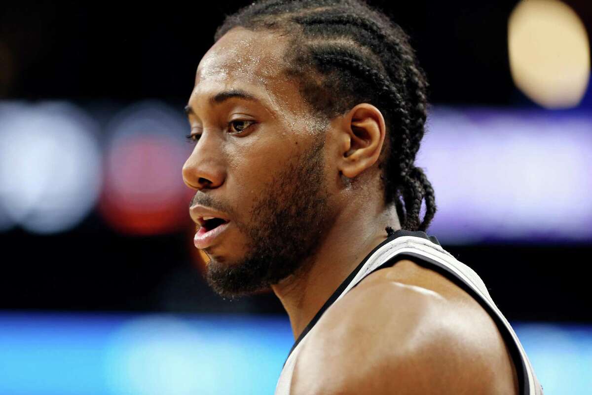 San Antonio Spurs' Kawhi Leonard pauses during second half action against the Sacramento Kings Saturday March 5, 2016 at the AT&T Center. The Spurs won 104-94.