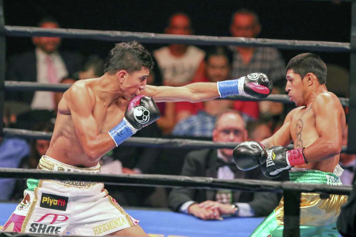 Mario Barrios, in white shorts, goes Sunday Sept. 6, 2015, against Jose Cen Torres, in green shorts, at the American Bank Center in Corpus Christi. Barrios won with a knock-out in the fourth round.