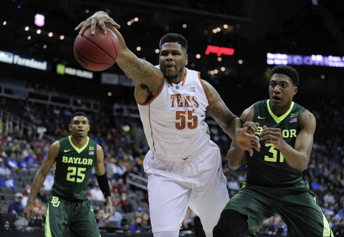 KANSAS CITY, MO - MARCH 10: Cameron Ridley #55 of the Texas Longhorns reaches out as he tries to gain control of the ball against Terry Maston #31 of the Baylor Bears in the first half during the quarterfinals of the Big 12 Basketball Tournament at Sprint Center on March 10, 2016 in Kansas City, Missouri. (Photo by Ed Zurga/Getty Images)