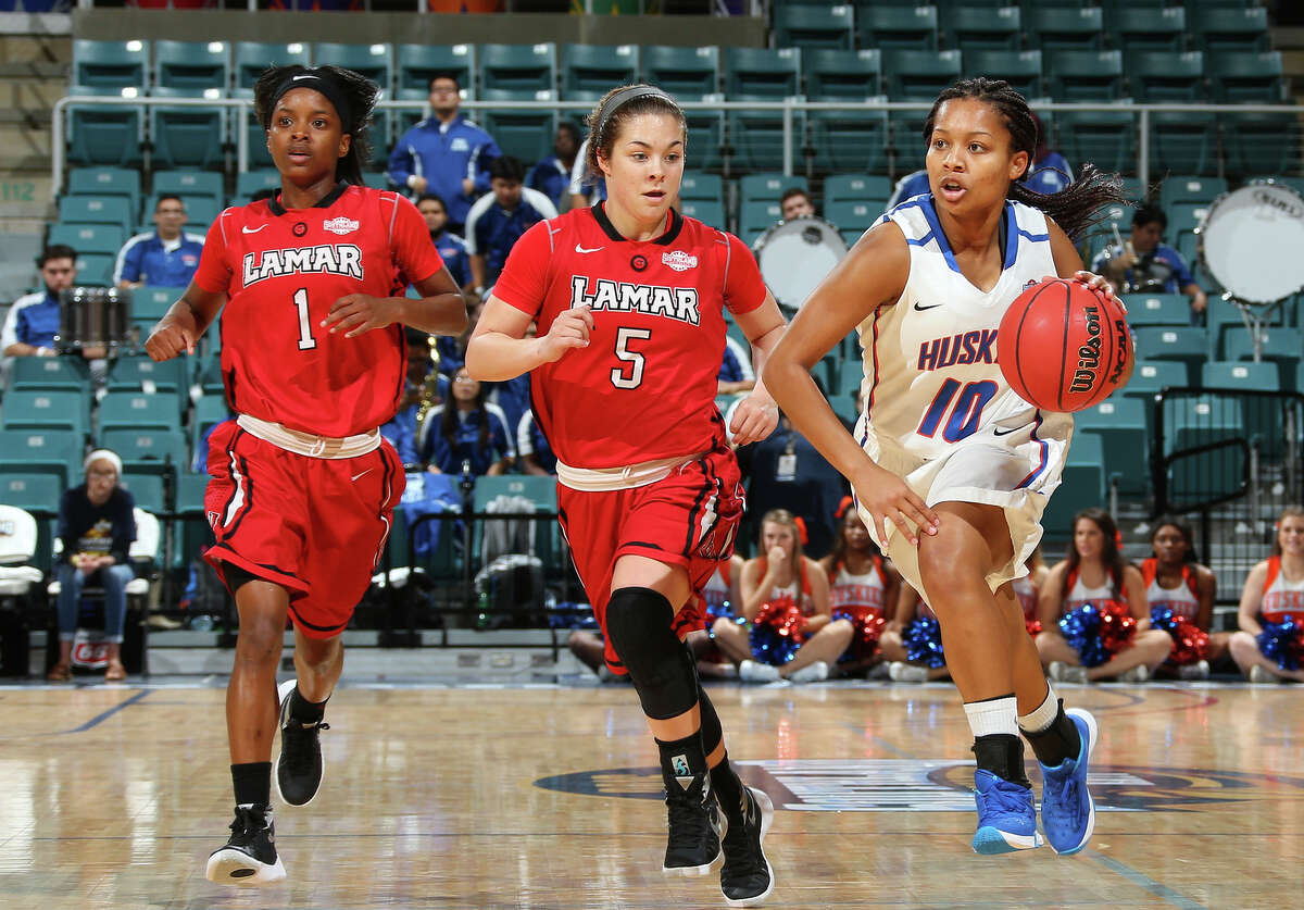 Lamar's Addesha Collins, left, and Baileigh O'Dell, center, chase down Houston Baptist's Bria Johnson during Thursday's Southland Conference Tournament game at the Merrell Center in Katy. Rick Yeatts/Southland Conference