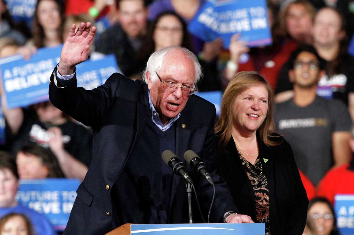 With his wife, Jane Sanders, by his side, Democratic presidential hopeful Sen. Bernie Sanders waves to the crowd during a Super Tuesday rally in Essex Junction, Vt. A reader says that Sanders, like Donald Trump, has tapped into the anger in America. But he has done it in a much different way.