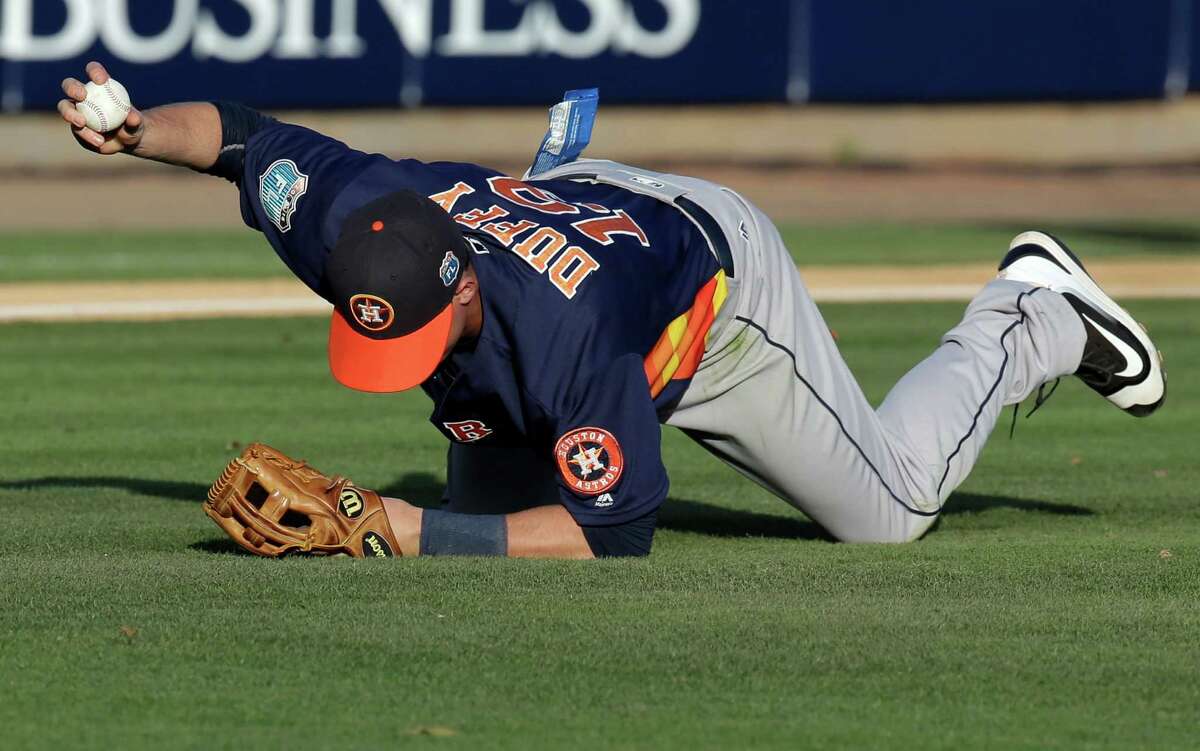 Astros third baseman Matt Duffy holds up the ball after making a catch in the second inning of Thursday's game against Washington at Viera, Fla.