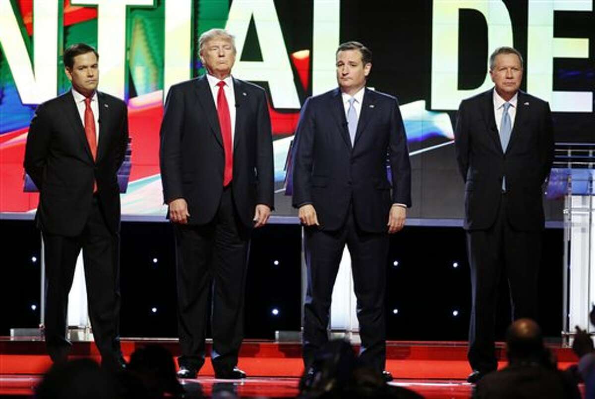 The Republican candidates stand on stage for the 12th GOP debate Thursday night in Miami, Florida. 