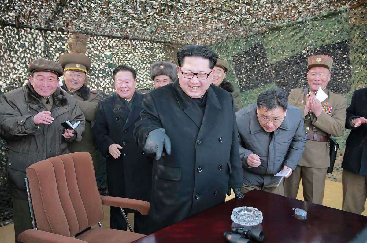 North Korean leader Kim Jong-Un (center) inspects a test-firing of the new-type large-caliber multiple launch rocket system at an undisclosed location this month. A reader fears that the U.S. may elect an unstable president to deal with an unstable dictator.