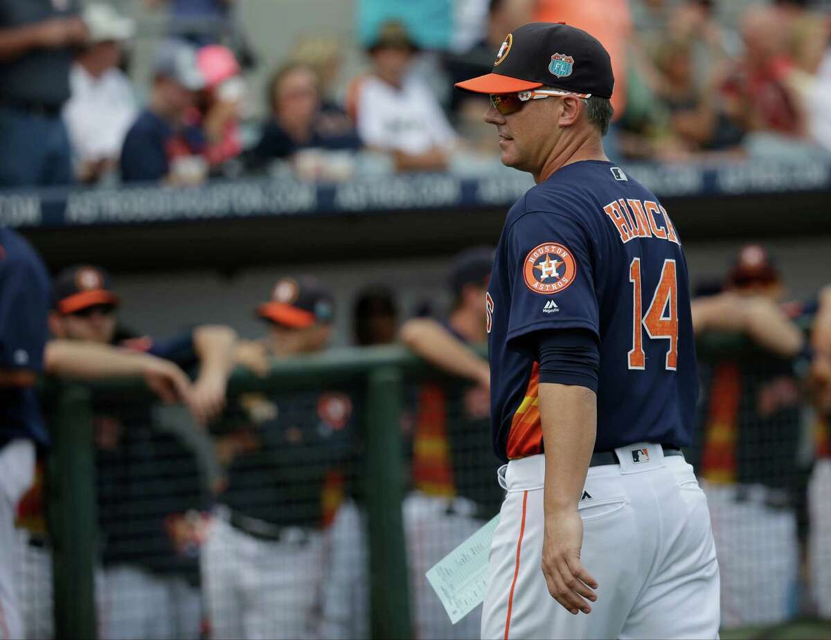 Houston Astros manager A.J. Hinch (14) walks back to the dugout after presenting the line up card to umpires before a spring training baseball game against the Detroit Tigers, Friday, March 11, 2016, in Kissimmee, Fla.