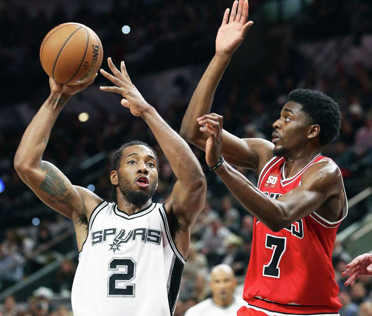 Kawhi Leoanrd passes away from Justin Holiday as the Spurs host Chicago at the AT&T Center on March 10, 2016.