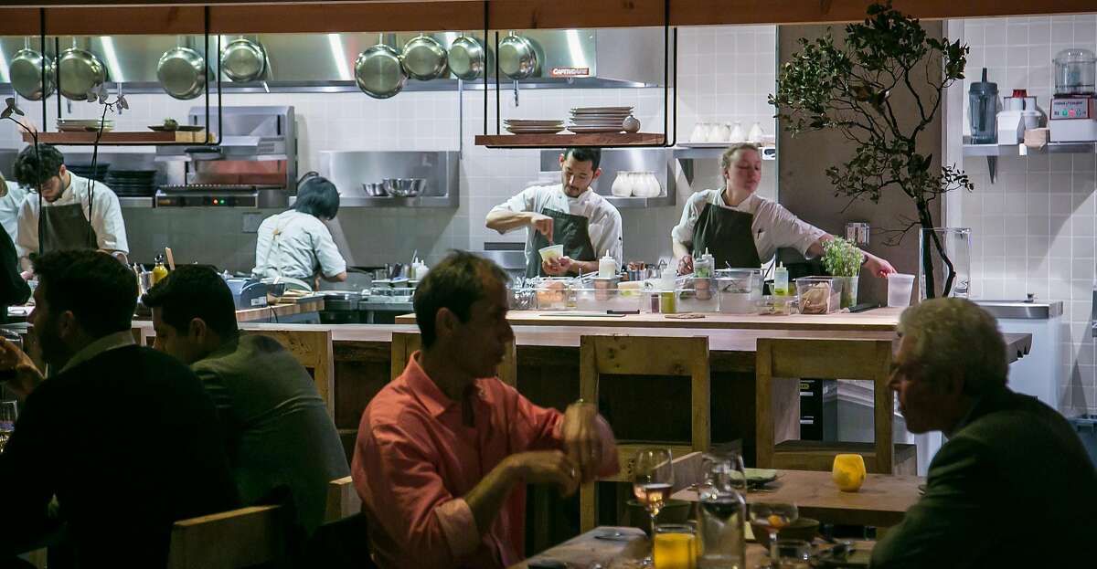 The kitchen as seen from the dining room at Perennial in San Francisco, Calif. on March 10, 2016.