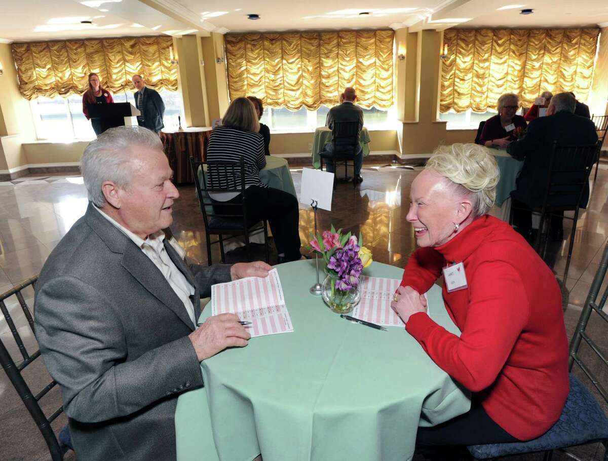 Pasquale Apruzzese, 83, of Norwalk, left, speaks with Janet Gold, 70 of Old Greenwich, during the senior speed dating event sponsored by the Stamford Senior Center and SilverSource, Inc., held at The Waters Edge at Giovanni's in Darien, Conn., Friday, March 11, 2016. Tony Savino of 1490-WGCH hosted the event for seniors between the ages of 70-90.